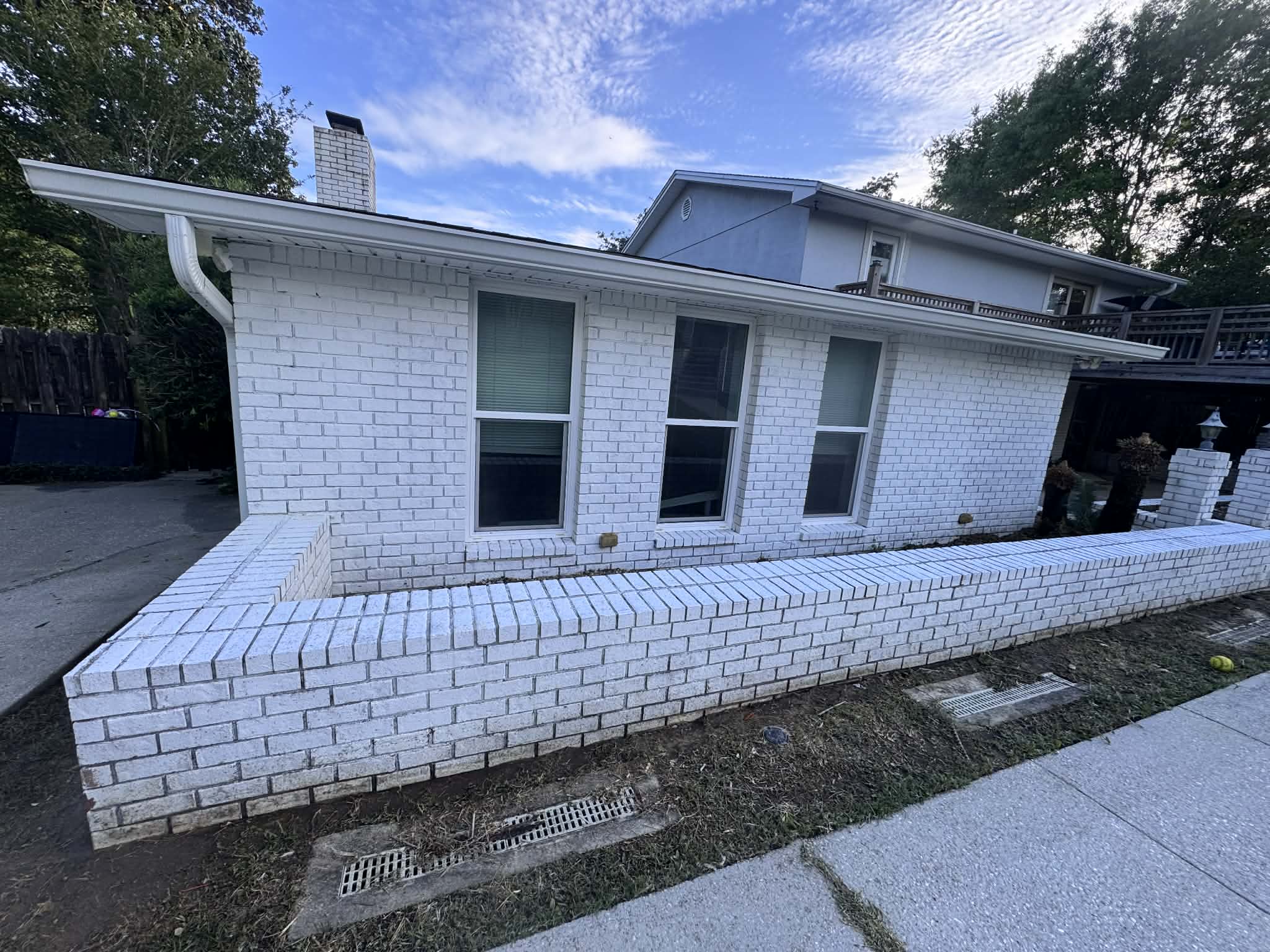 Heavily soiled driveway, patio, and house in Cantonment, Fl Thumbnail